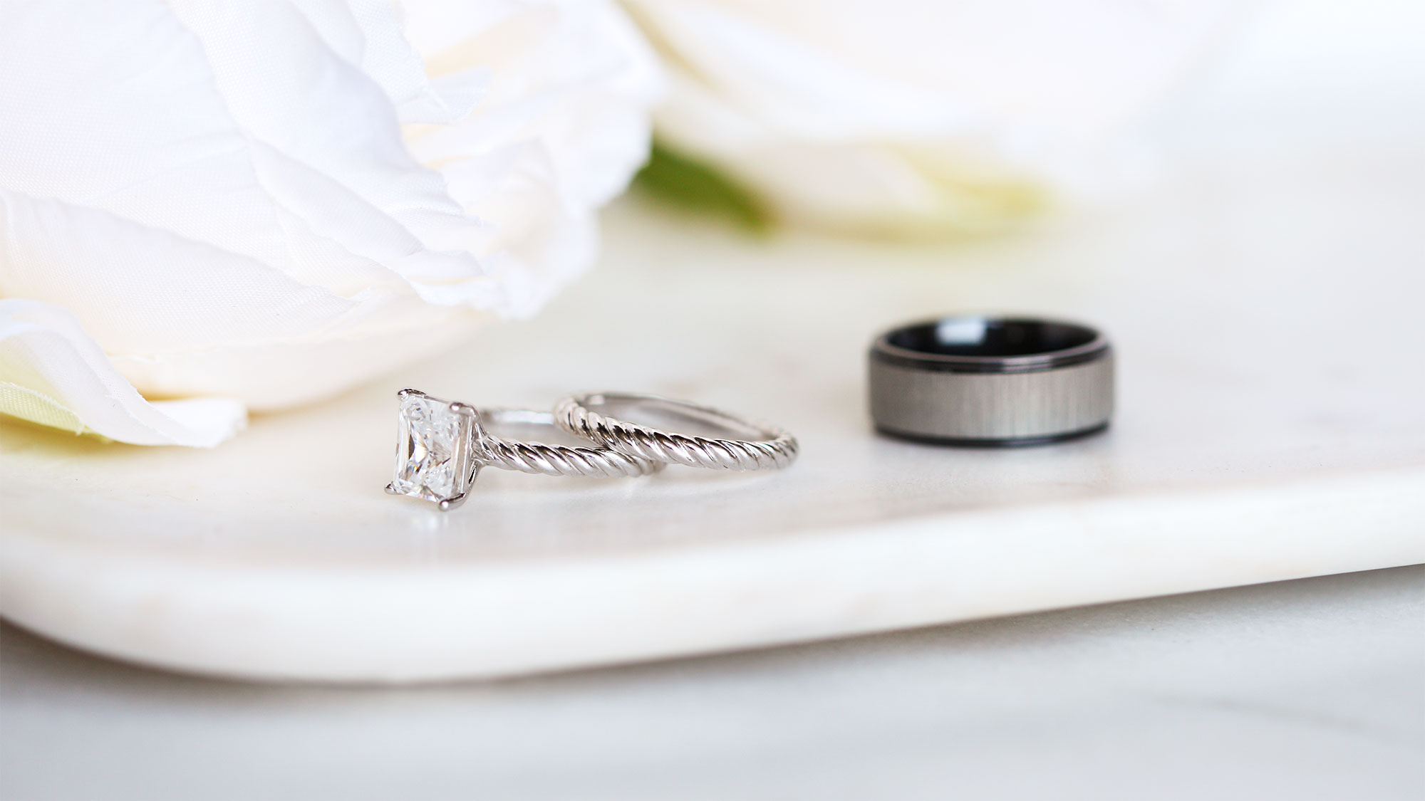 The women's Fiji wedding ring set and men's Levi wedding band