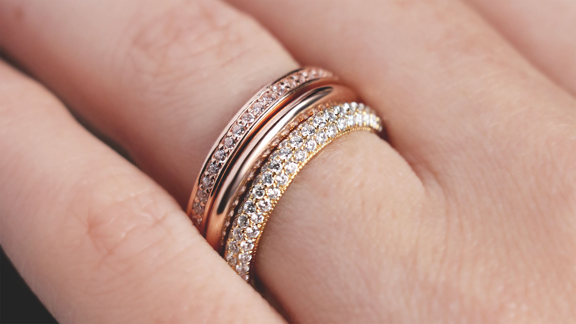 A mixed-metal ring stack featuring accented and classic styles