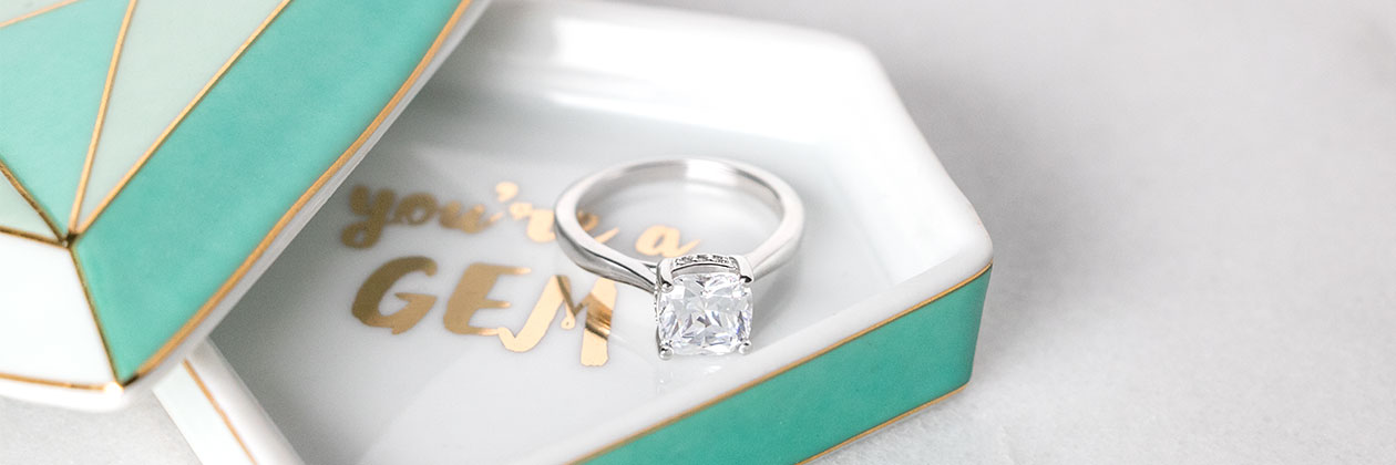 A Diamond Nexus engagement ring in a ring dish