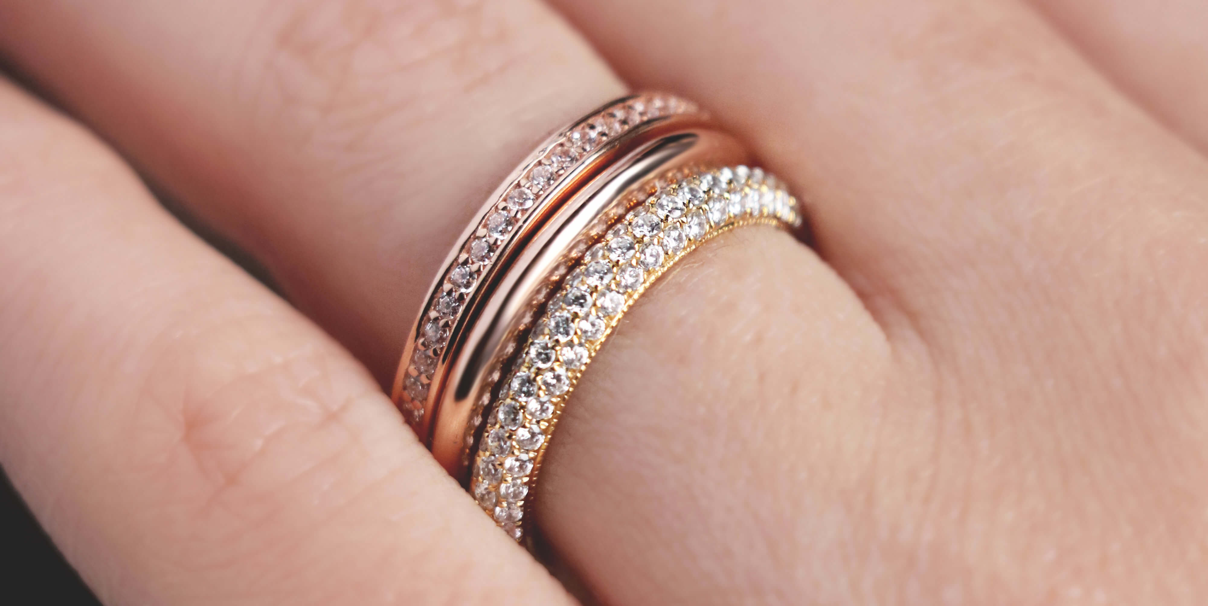 A Diamond Nexus wedding band stack with mixed-metals