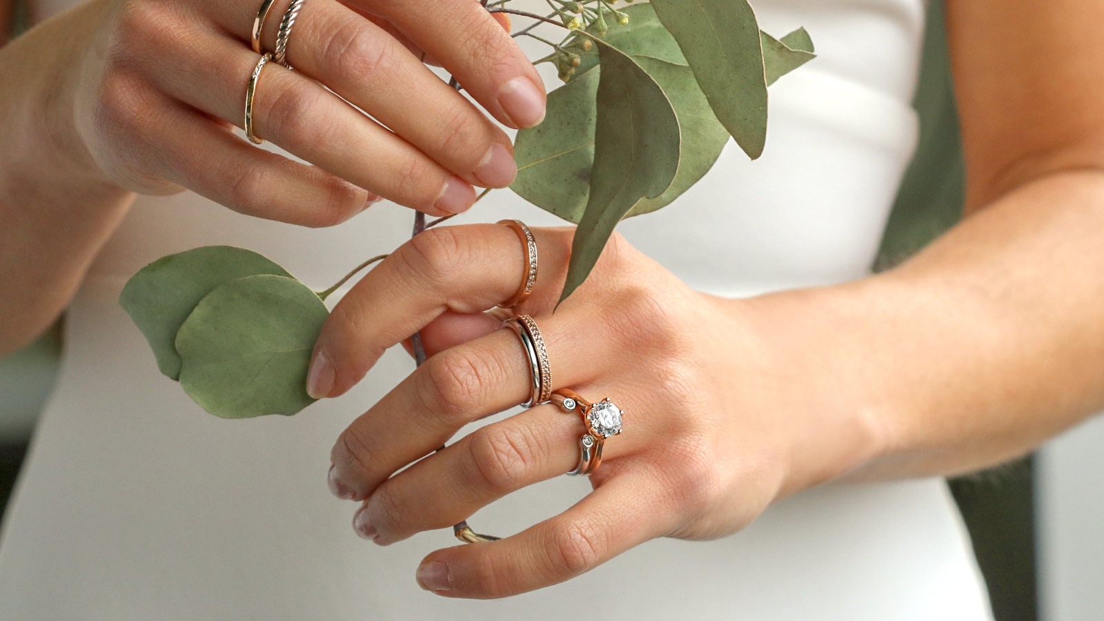 A bride wearing assorted rings from Diamond Nexus