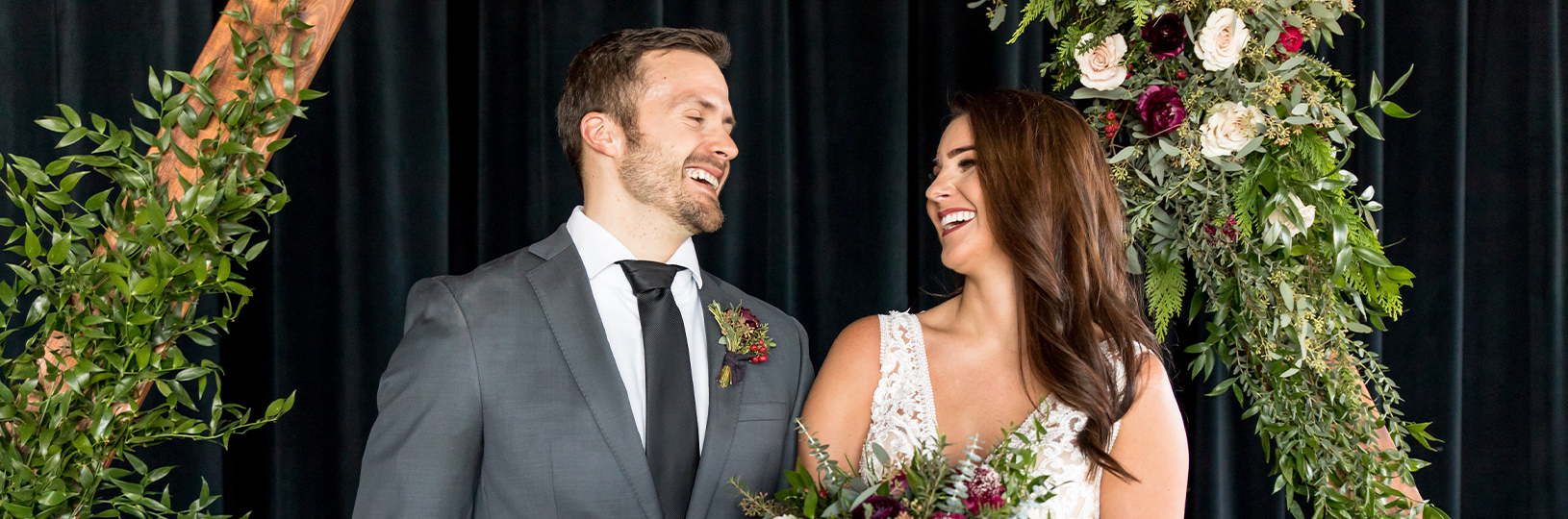 Bride and groom on wedding day laughing