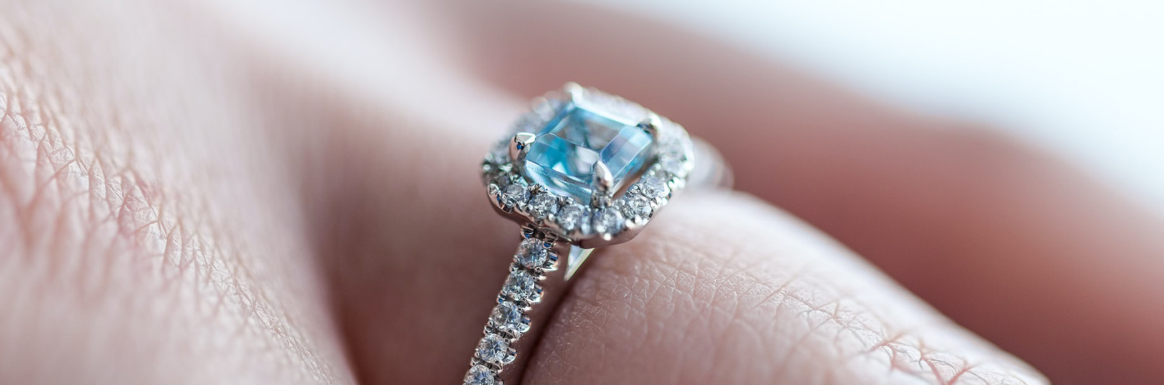 light blue accented engagement ring