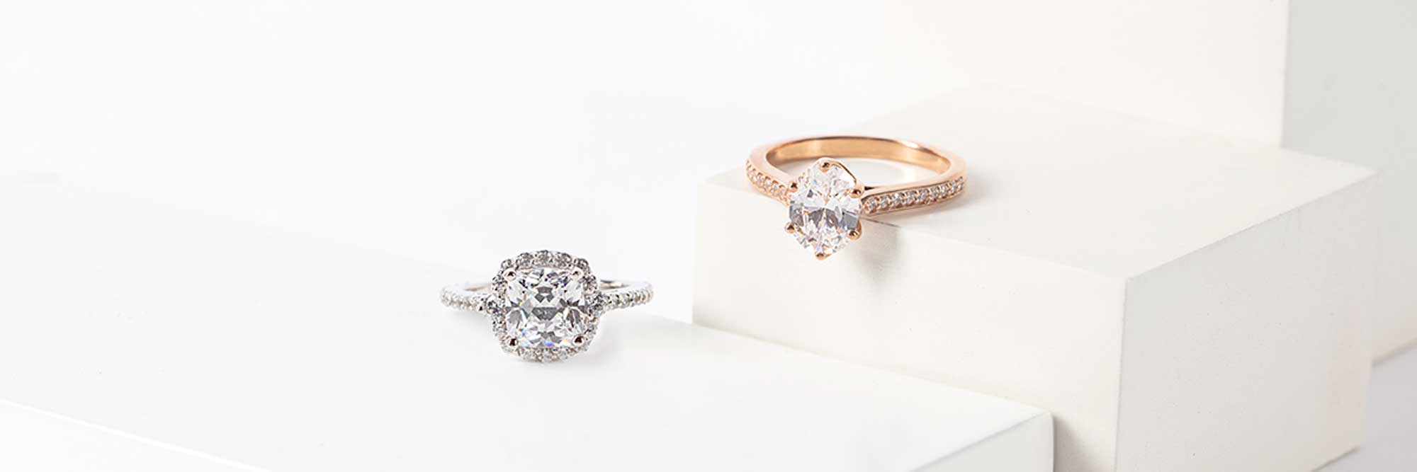 oval and cushion cut engagement rings compared side by side