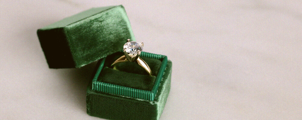 engagement ring in a suede ring box