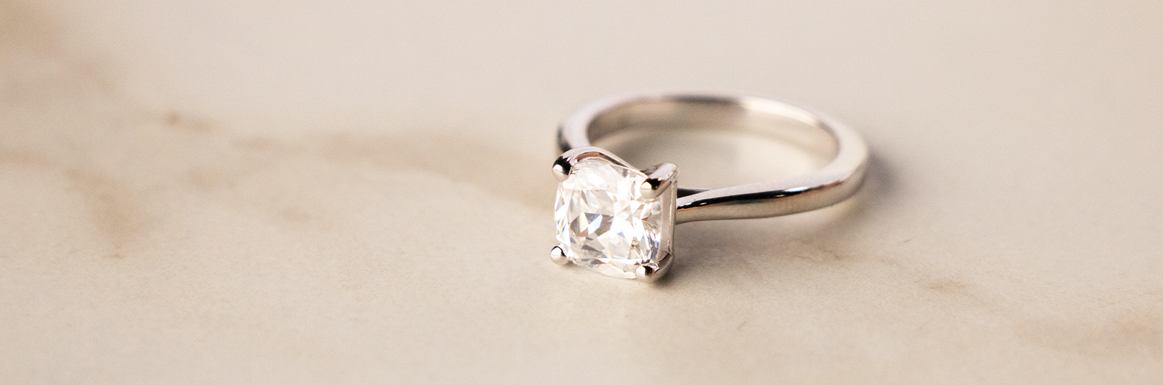 A solitaire lab created diamond simulant engagement ring