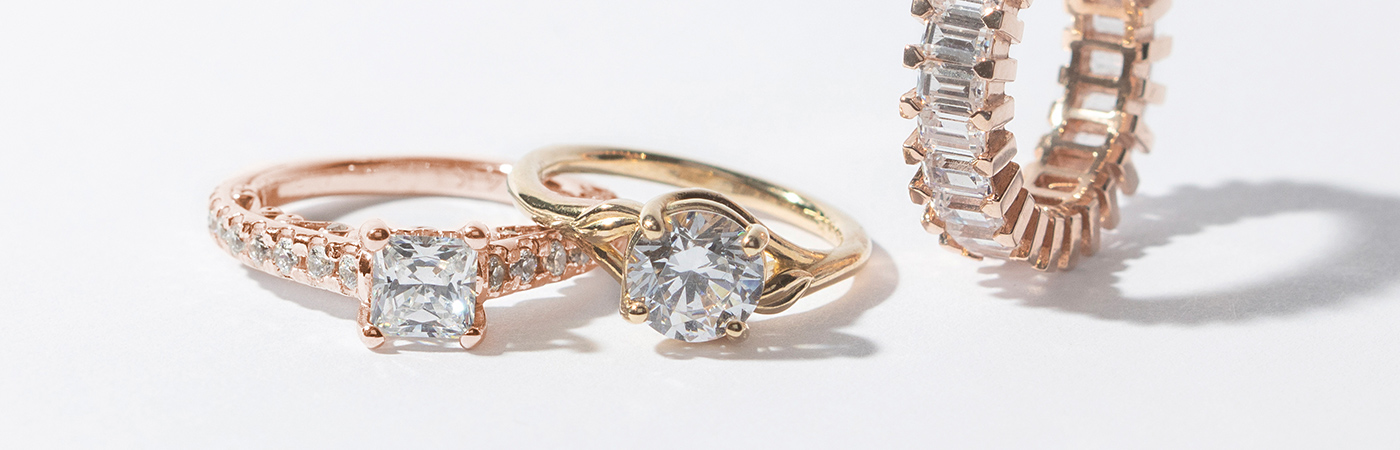 hree Diamond Nexus engagement rings in yellow and rose gold