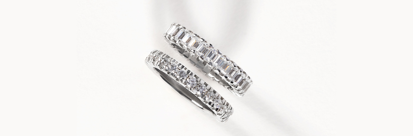 Two accented wedding bands featuring diamond simulants