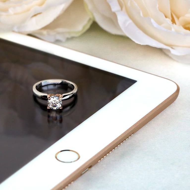 engagement ring on a tablet