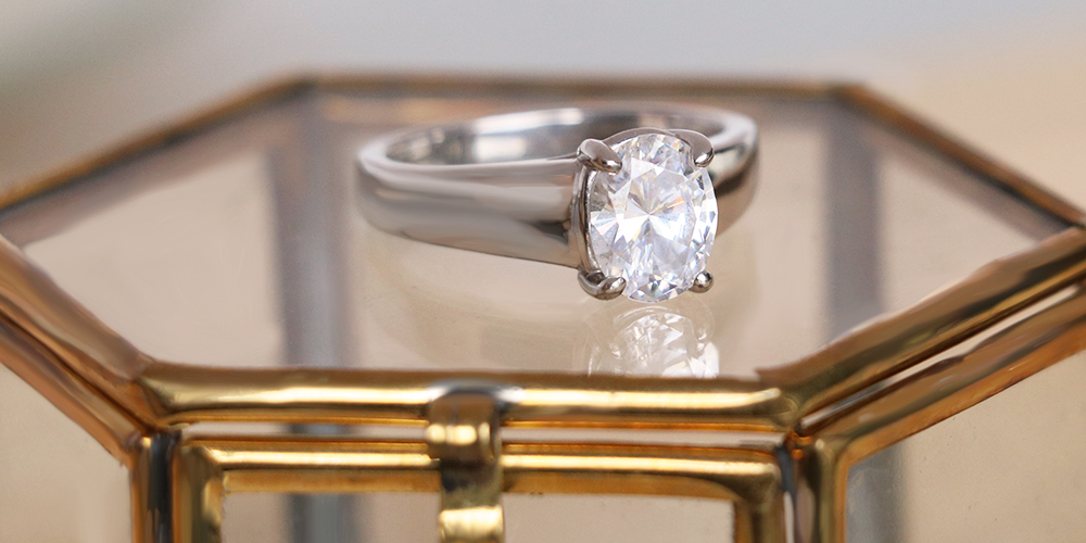 a solitaire ring with a wide band