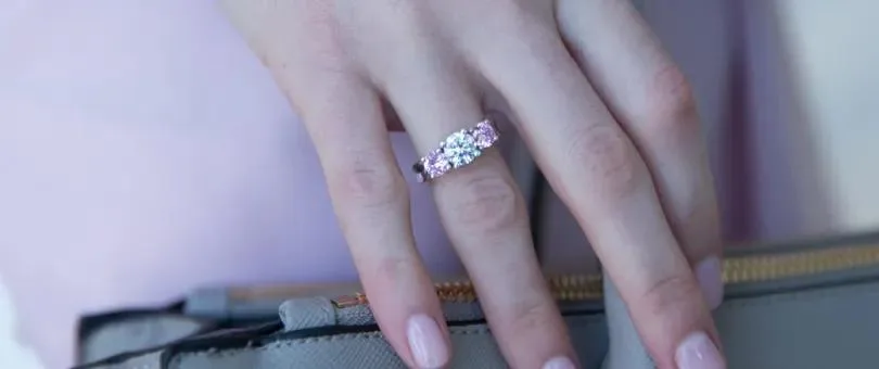 an engagement ring on a right hand