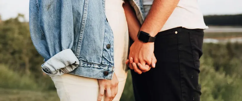 man and woman holding hands